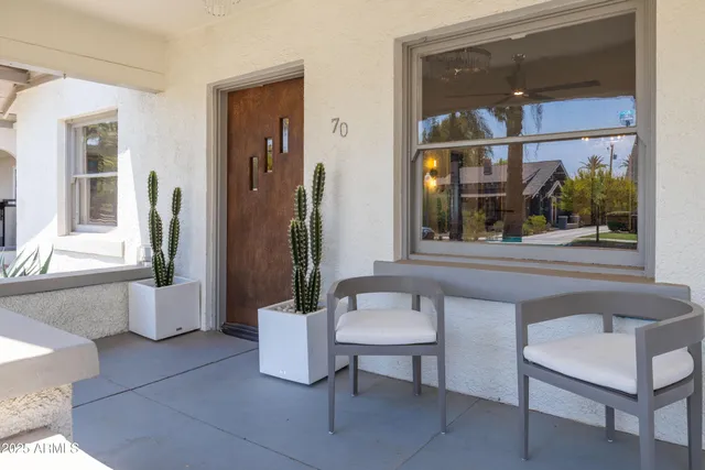 a living room with fireplace furniture and a wooden floor