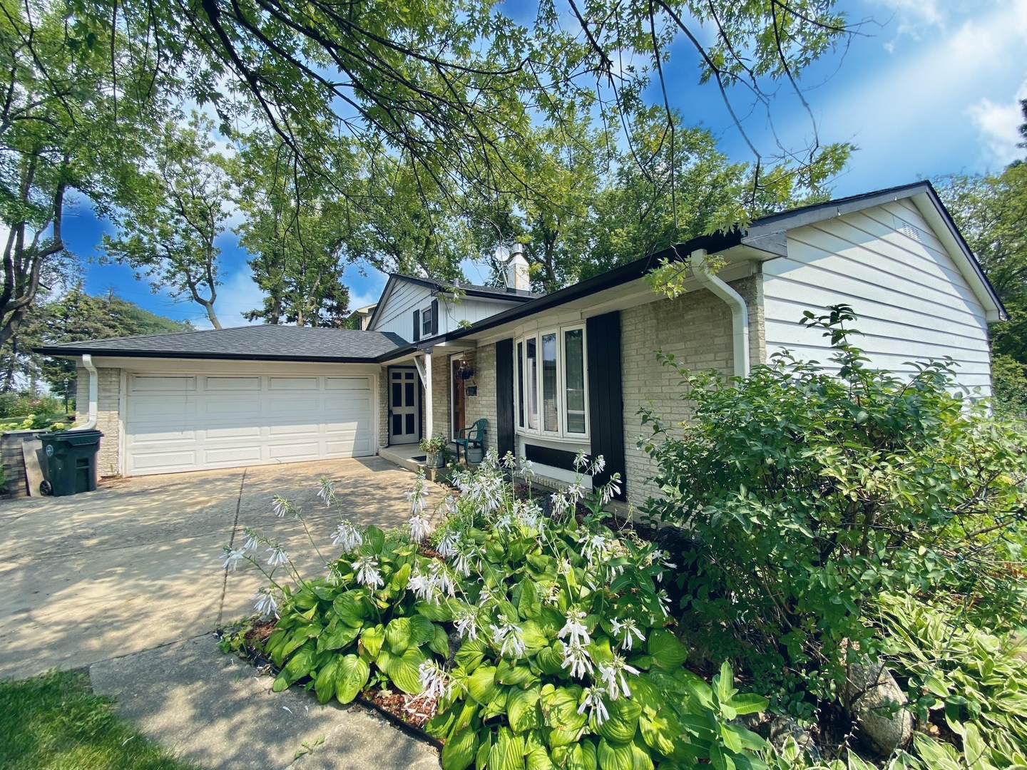 3510 East Frontage Road Rolling Meadows, IL 60008 - Photo 1 of 27 a front view of a house with a garden