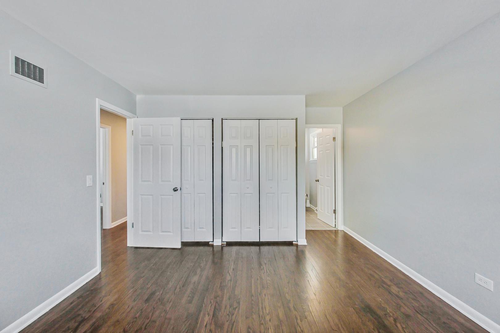 3510 East Frontage Road Rolling Meadows, IL 60008 - Photo 17 of 27 a view of a room with wooden floor and white walls