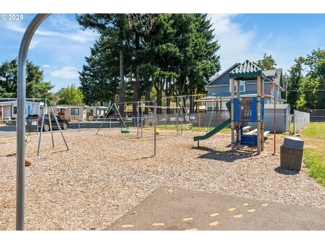 a view of a park with swings