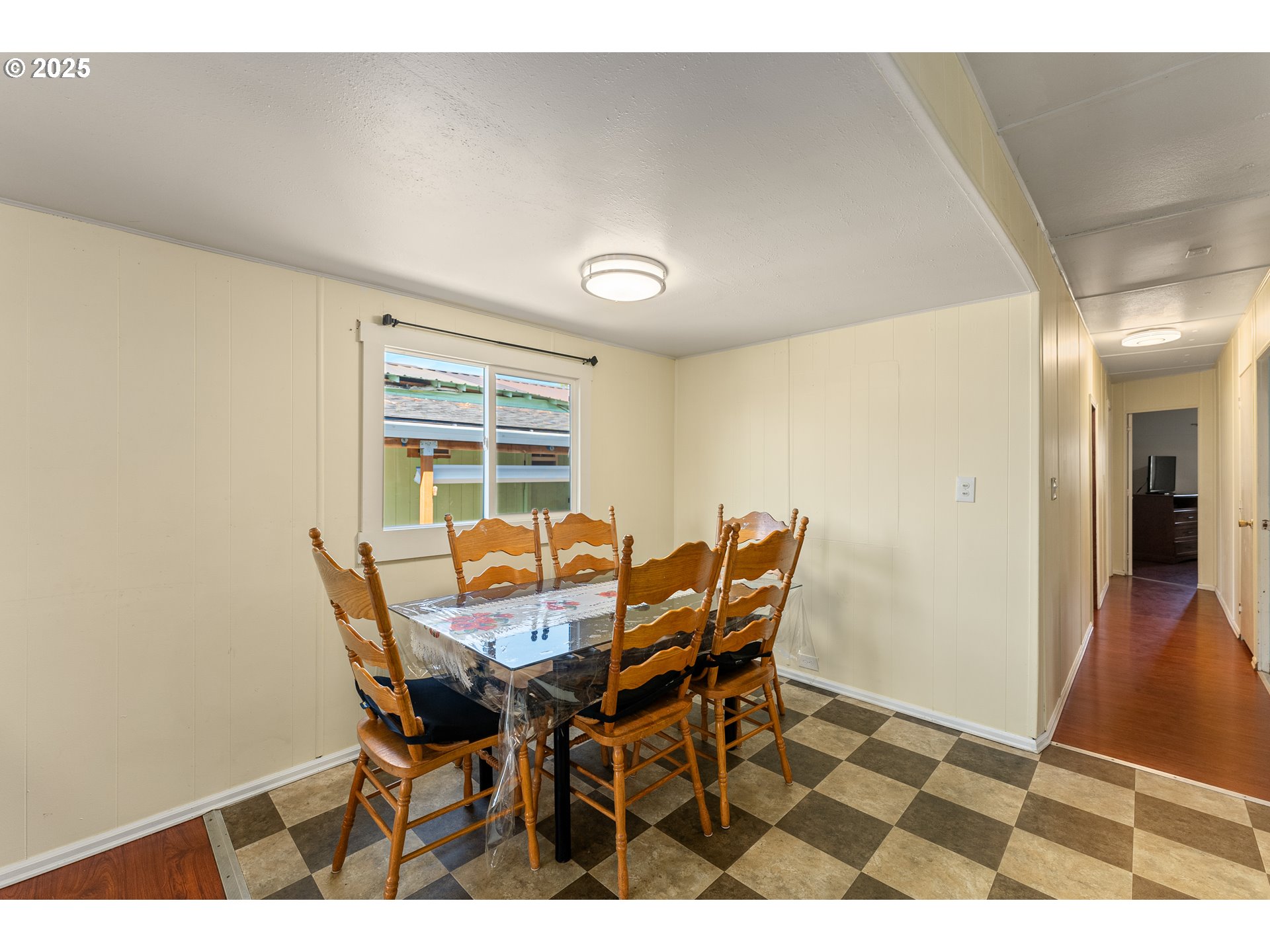 8951 Southeast Fuller Road, Unit 7 Happy Valley, OR 97086 - Photo 5 of 29 a view of a dining room with furniture and wooden floor