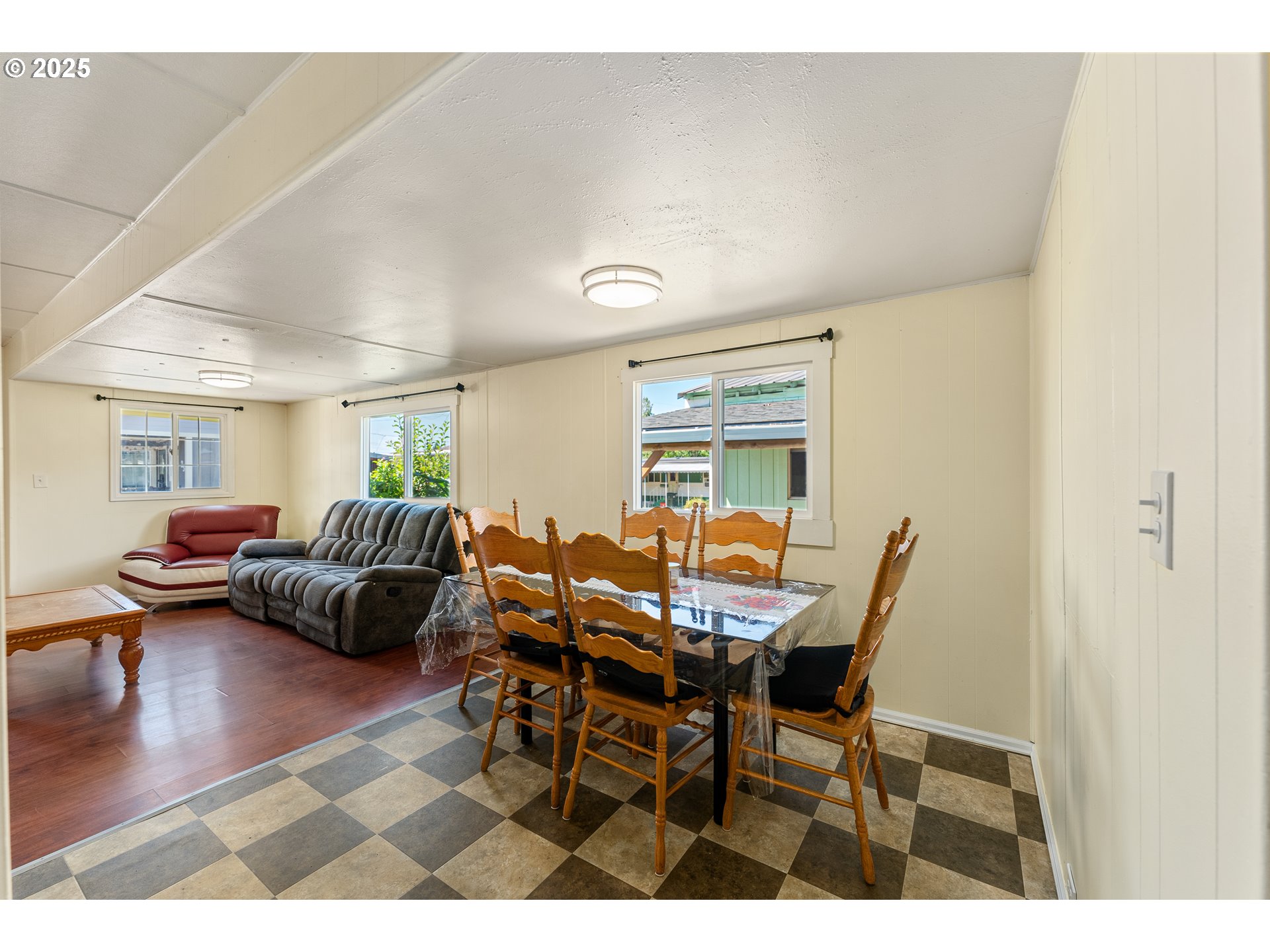 8951 Southeast Fuller Road, Unit 7 Happy Valley, OR 97086 - Photo 6 of 29 a view of a livingroom and dining room
