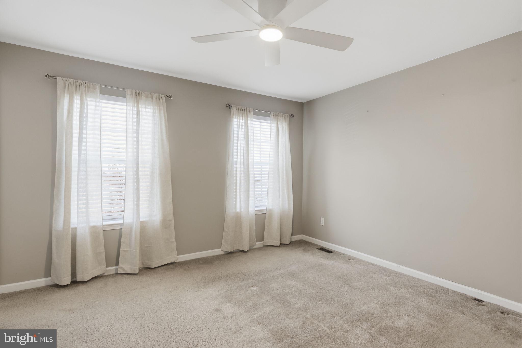 3832 William Daves Road, Unit 3 Doylestown, PA 18902 - Photo 15 of 35 an empty room with windows and closet