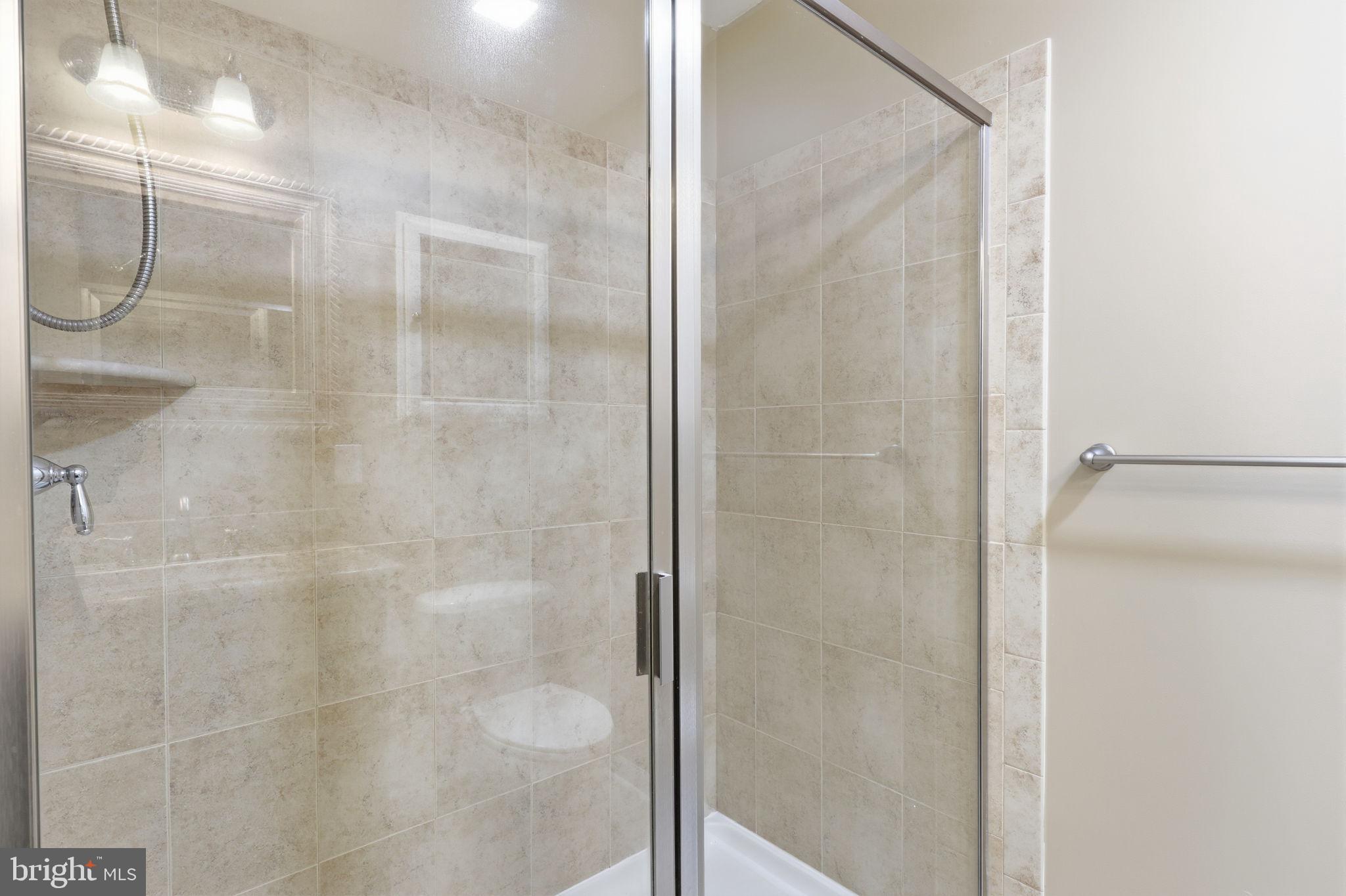 3832 William Daves Road, Unit 3 Doylestown, PA 18902 - Photo 17 of 35 a bathroom with a glass shower door