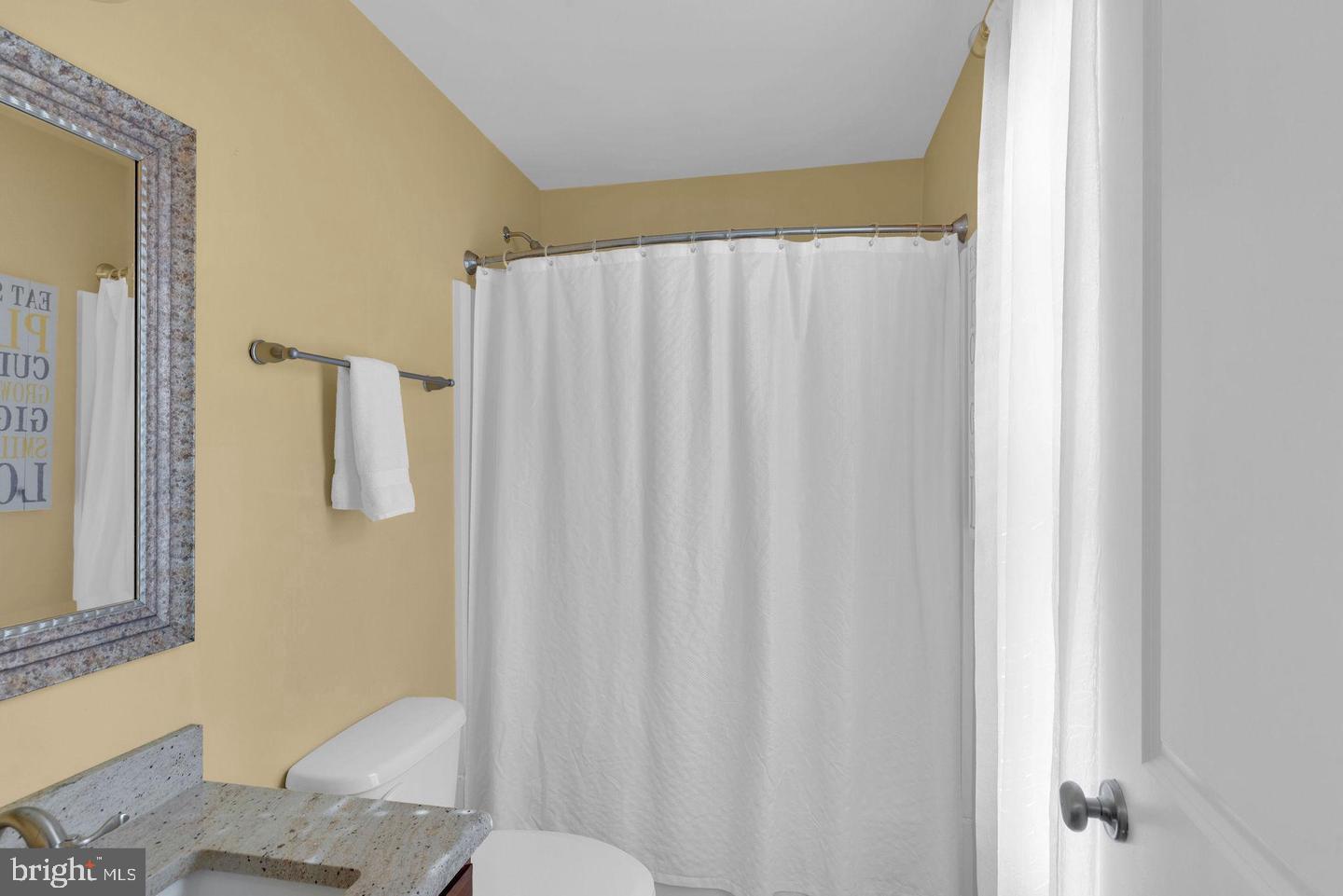 3832 William Daves Road, Unit 3 Doylestown, PA 18902 - Photo 20 of 35 a bathroom with a shower curtain and a toilet