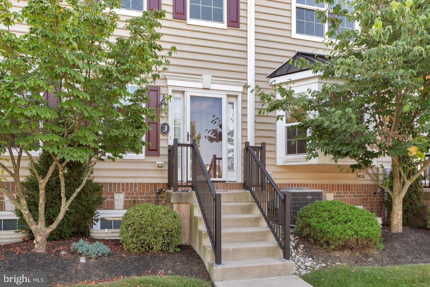 3832 William Daves Road, Unit 3 Doylestown, PA 18902 - Photo 2 of 35 a front view of a house with a yard