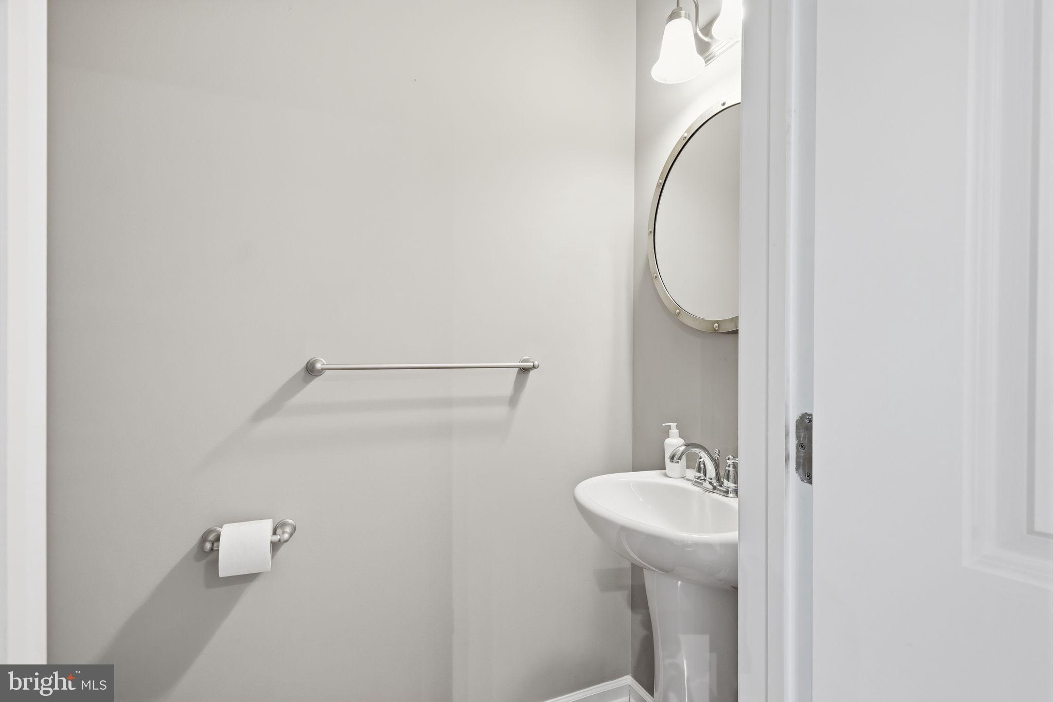 3832 William Daves Road, Unit 3 Doylestown, PA 18902 - Photo 21 of 35 a bathroom with a sink a toilet and a mirror
