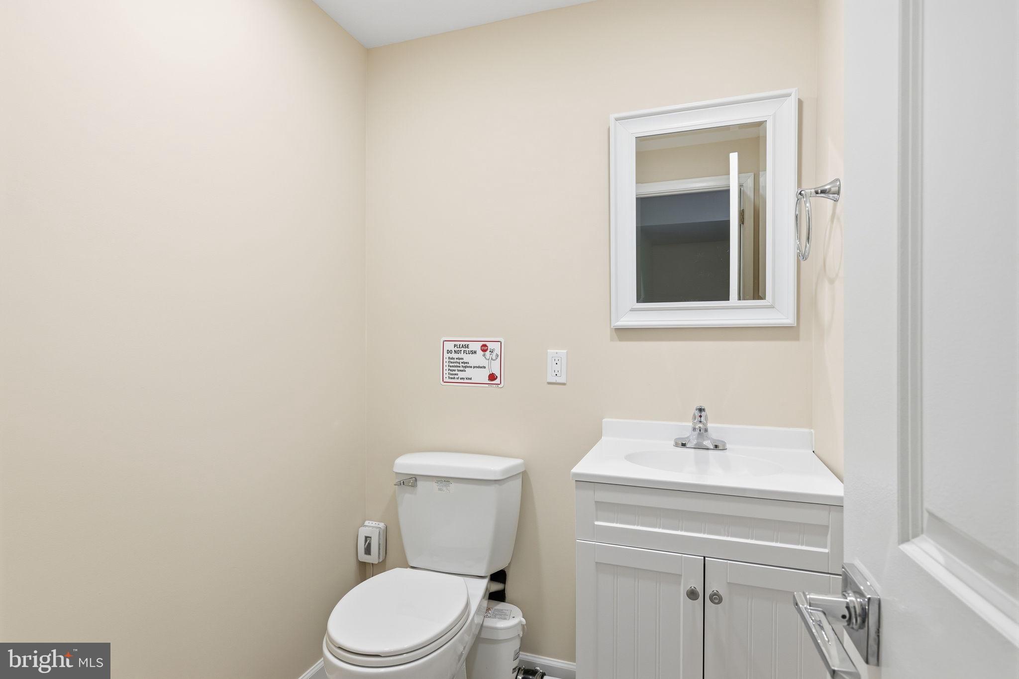 3832 William Daves Road, Unit 3 Doylestown, PA 18902 - Photo 26 of 35 a bathroom with a sink a toilet and mirror