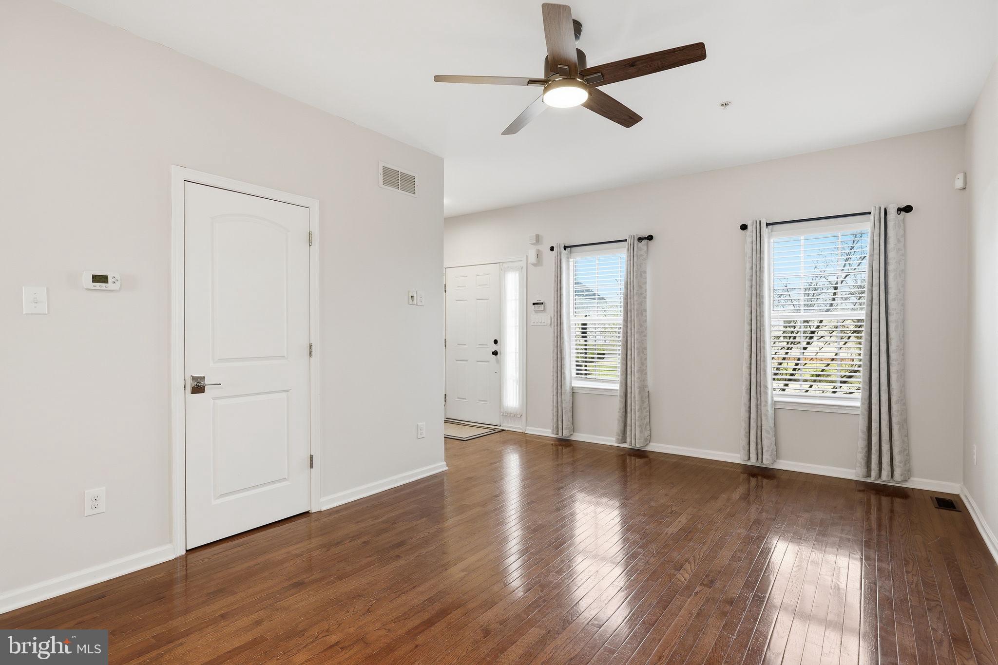 3832 William Daves Road, Unit 3 Doylestown, PA 18902 - Photo 6 of 35 a view of empty room with wooden floor and fan