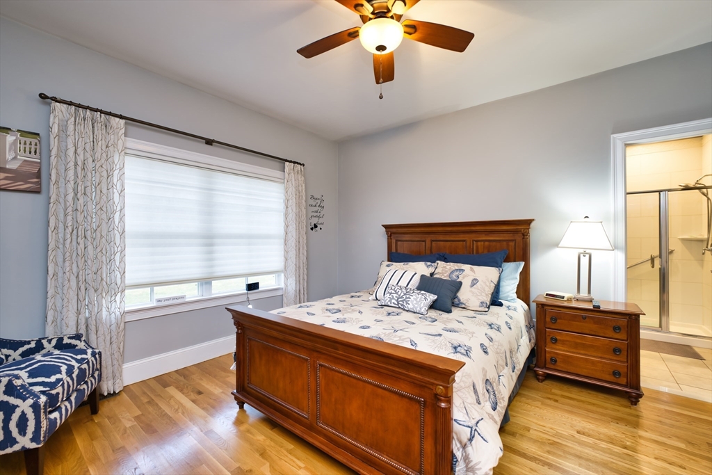 8 Hathaway Pond Circle, Unit 8 Rochester, MA 02770 - Photo 14 of 24 a bedroom with a bed and a window