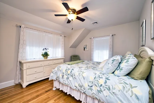 a bed room with a bed and a window