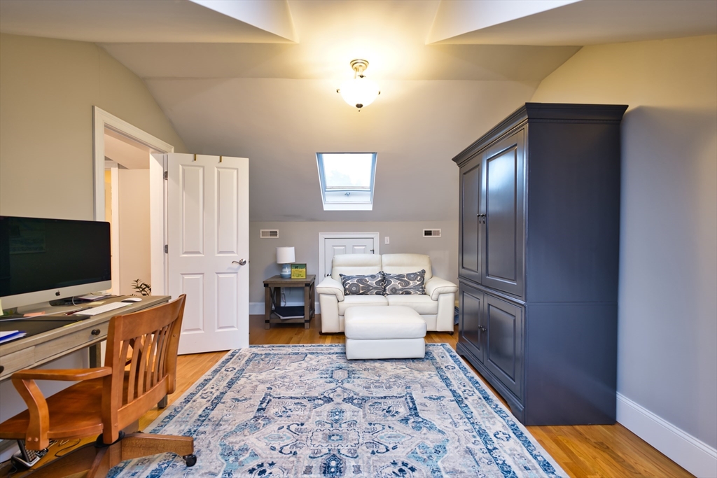 8 Hathaway Pond Circle, Unit 8 Rochester, MA 02770 - Photo 18 of 24 a room with furniture and a flat screen tv