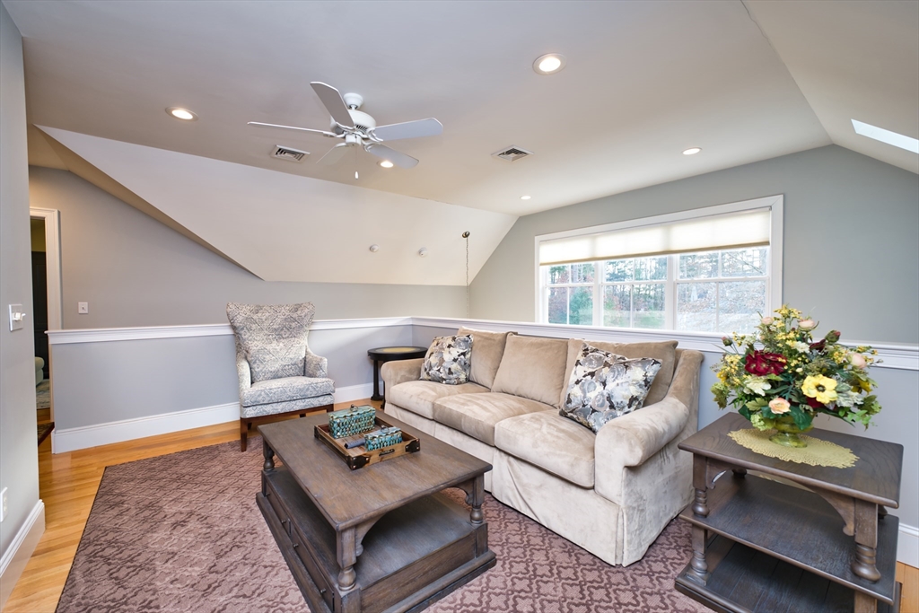 8 Hathaway Pond Circle, Unit 8 Rochester, MA 02770 - Photo 19 of 24 a living room with furniture and a large window