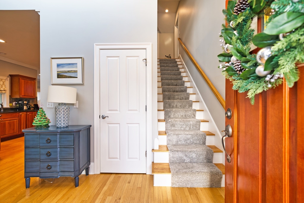 8 Hathaway Pond Circle, Unit 8 Rochester, MA 02770 - Photo 5 of 24 a view of a hallway with wooden floor and entryway