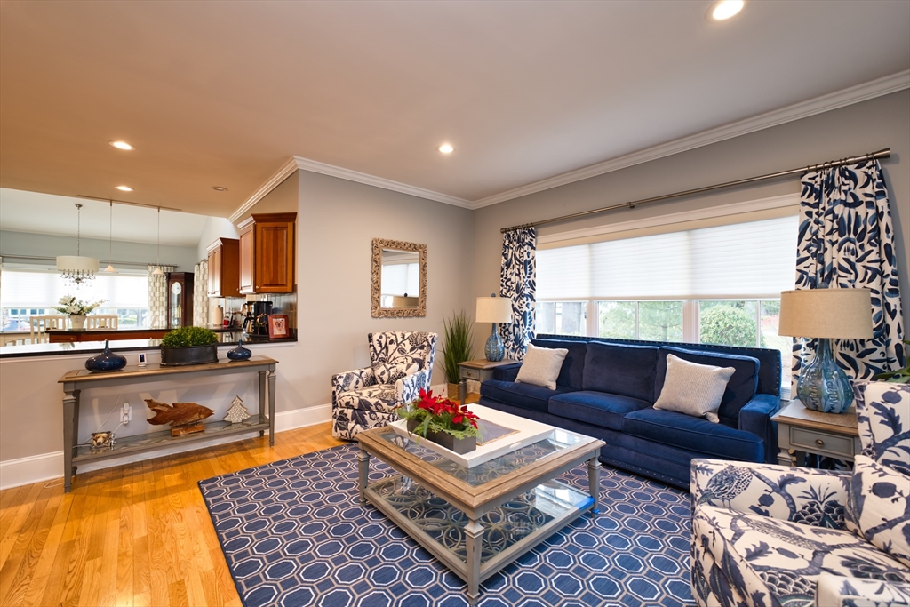 8 Hathaway Pond Circle, Unit 8 Rochester, MA 02770 - Photo 10 of 24 a living room with furniture and a large window