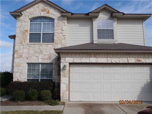 12017 Springs Head Loop Austin, TX 78717 - Photo 1 of 1 a front view of a house with garage