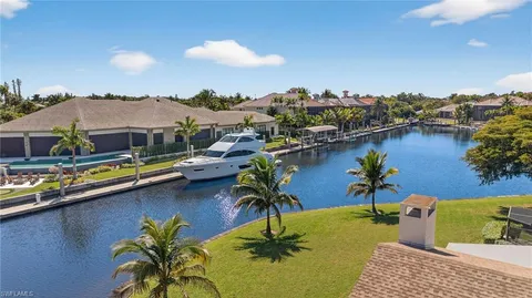 a view of swimming pool outdoor seating and lake view