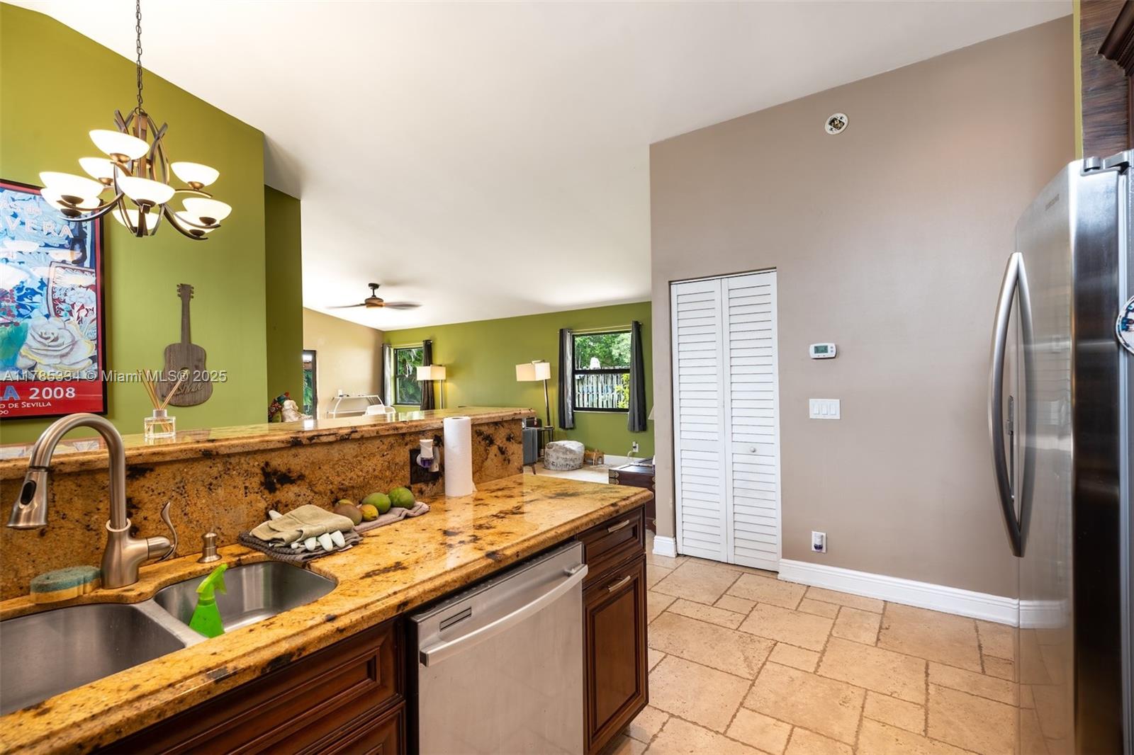 563 Lakeside Circle Sunrise, FL 33326 - Photo 11 of 36 a bathroom with a double vanity sink and a mirror