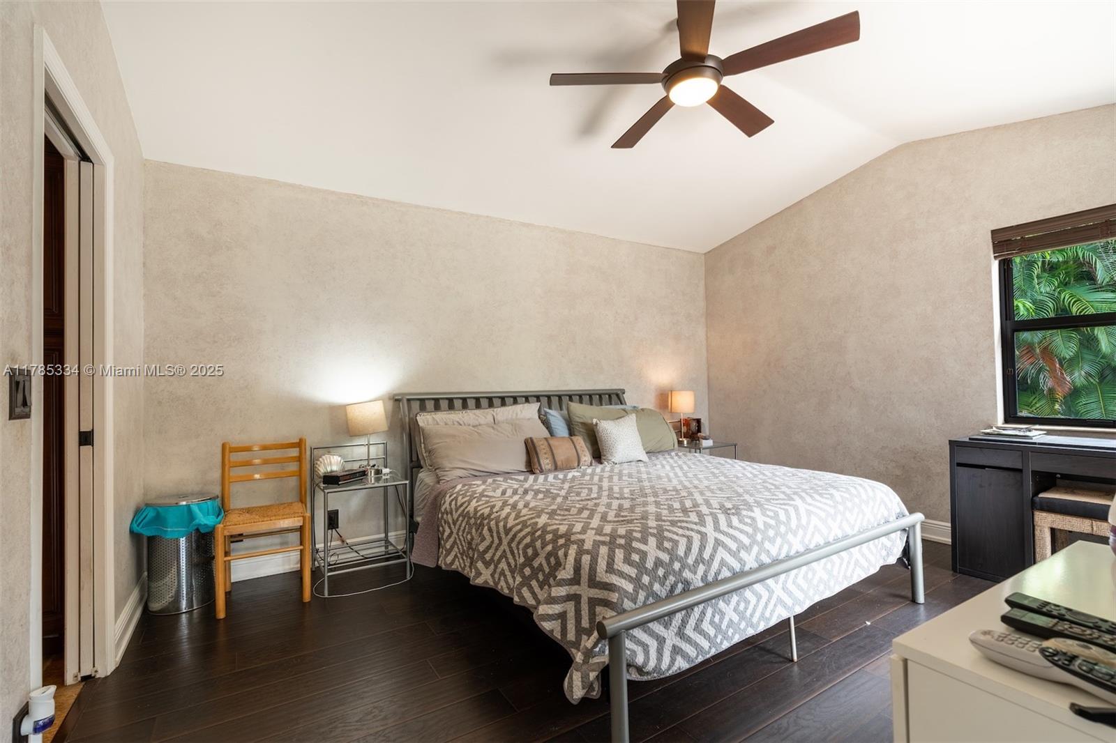 563 Lakeside Circle Sunrise, FL 33326 - Photo 13 of 36 a bedroom with a bed wooden floor and window