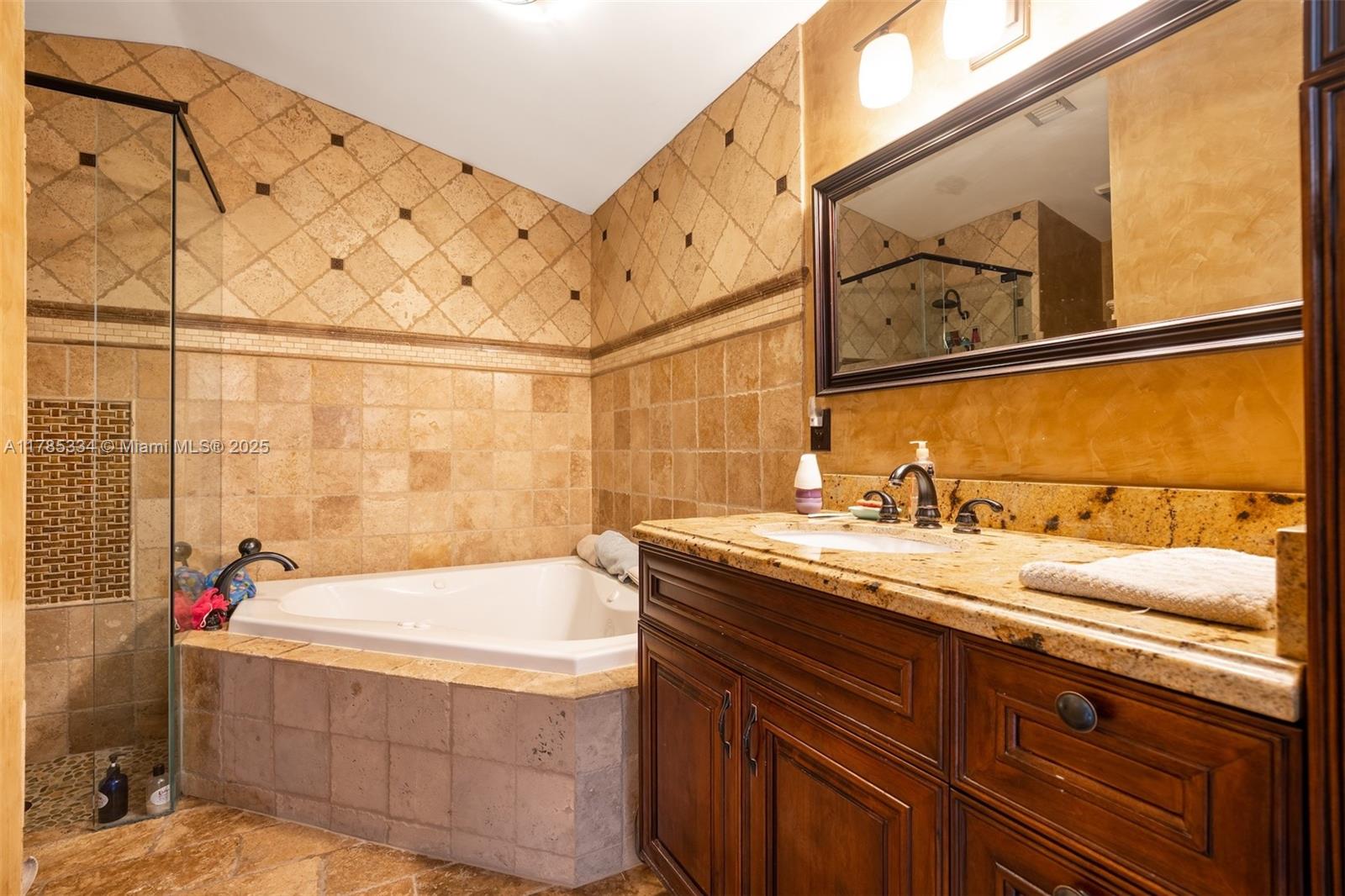 563 Lakeside Circle Sunrise, FL 33326 - Photo 16 of 36 a bathroom with a sink and a bathtub