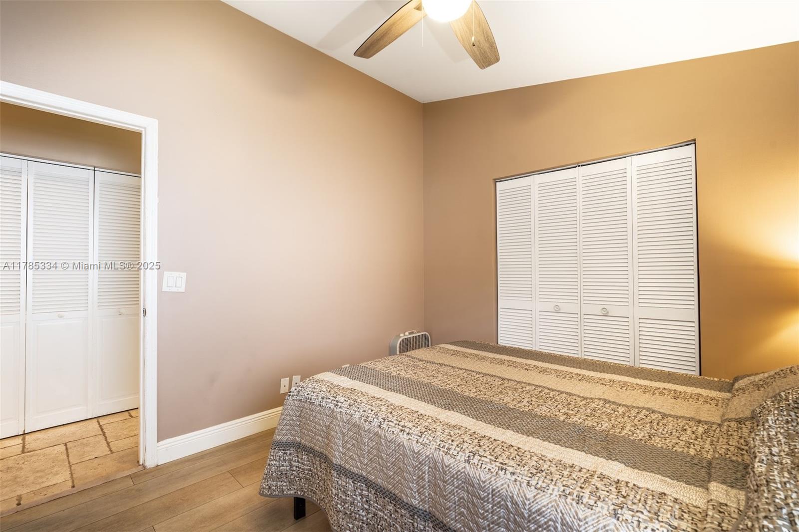 563 Lakeside Circle Sunrise, FL 33326 - Photo 19 of 36 a bedroom with a bed and a window