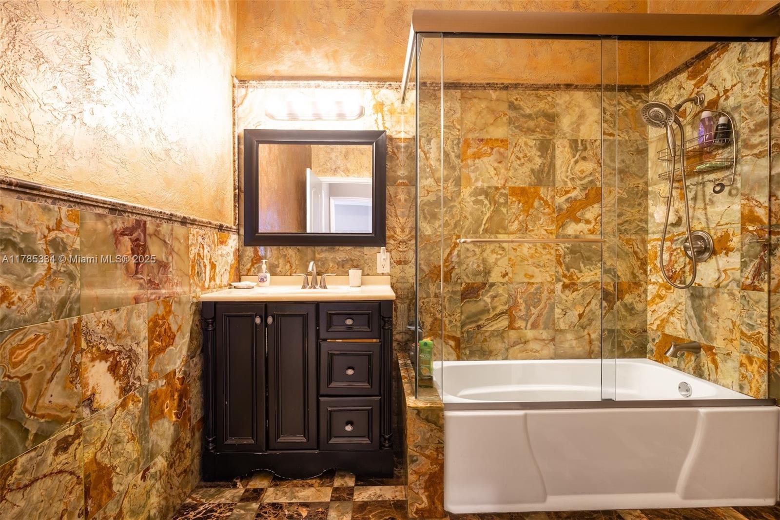 563 Lakeside Circle Sunrise, FL 33326 - Photo 20 of 36 a bathroom with a sink and a bathtub