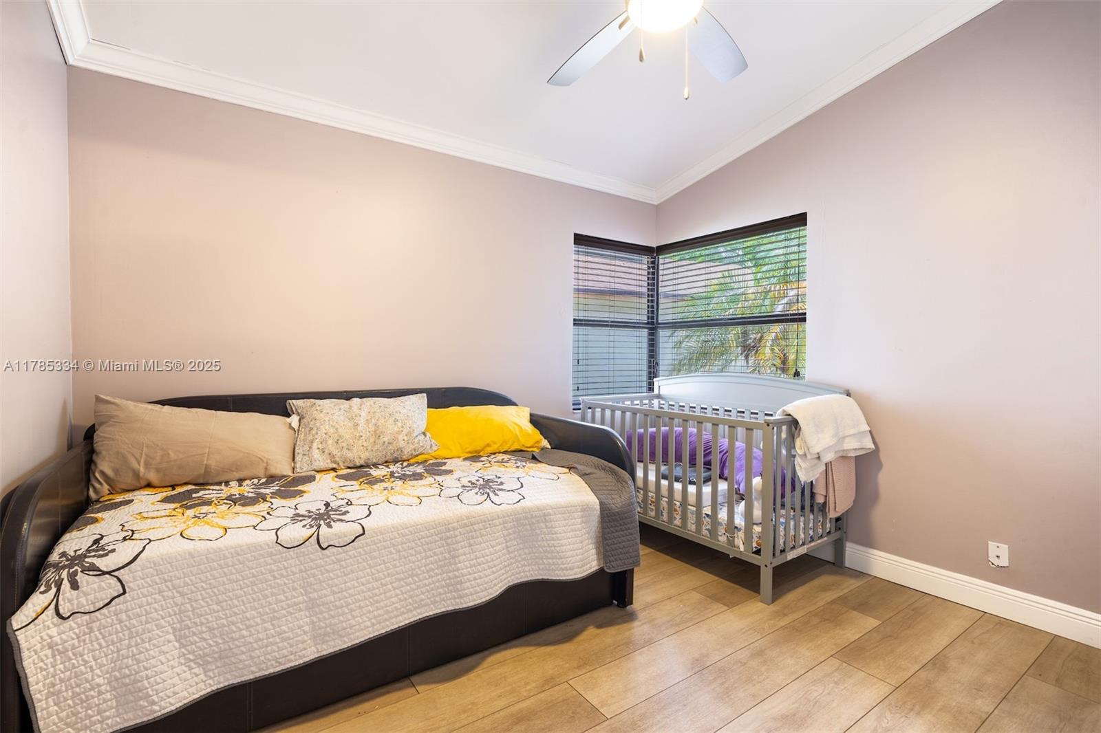 563 Lakeside Circle Sunrise, FL 33326 - Photo 21 of 36 a bedroom with a bed and a window