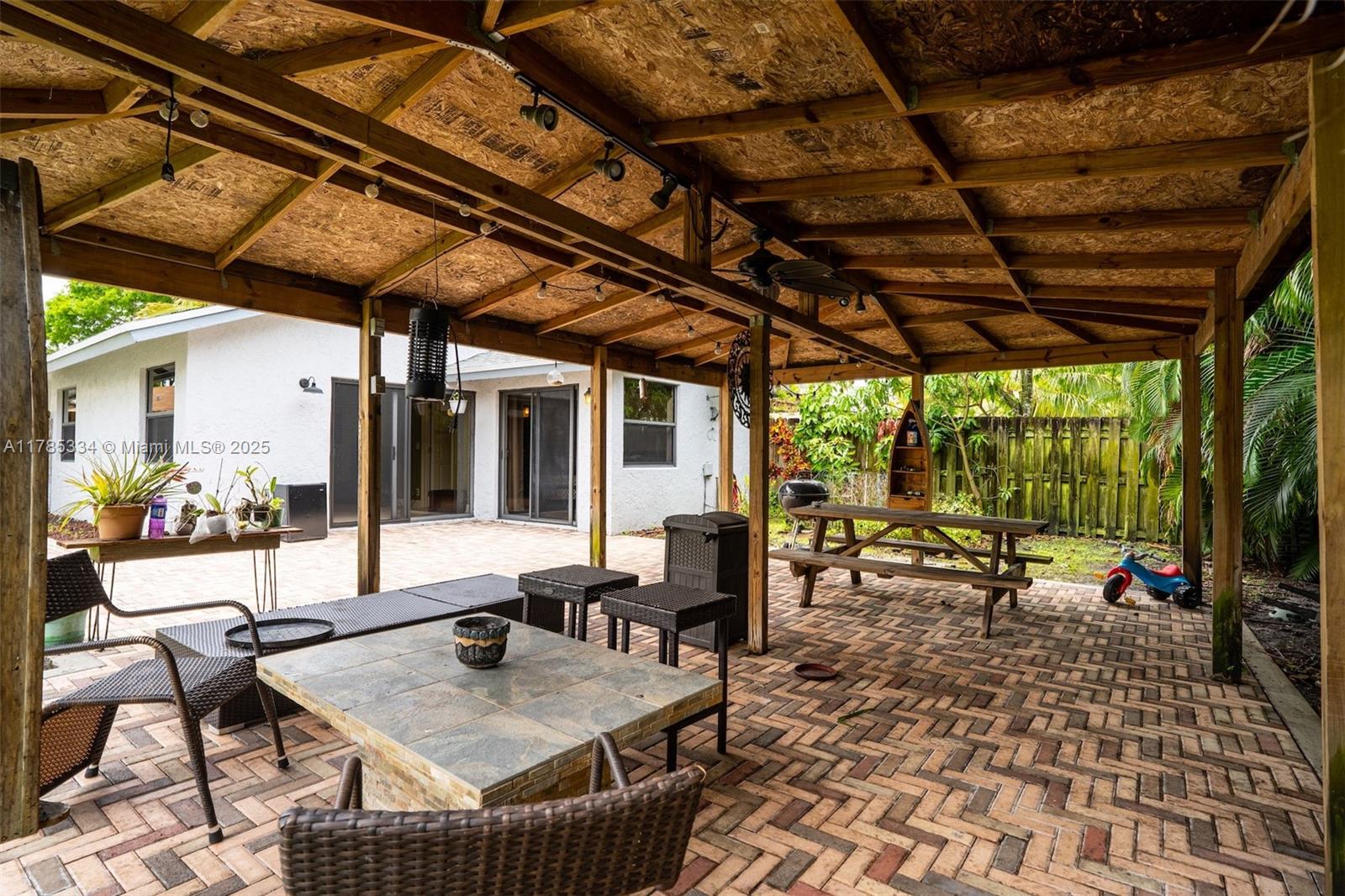 563 Lakeside Circle Sunrise, FL 33326 - Photo 26 of 36 a dining room with furniture and a floor to ceiling window