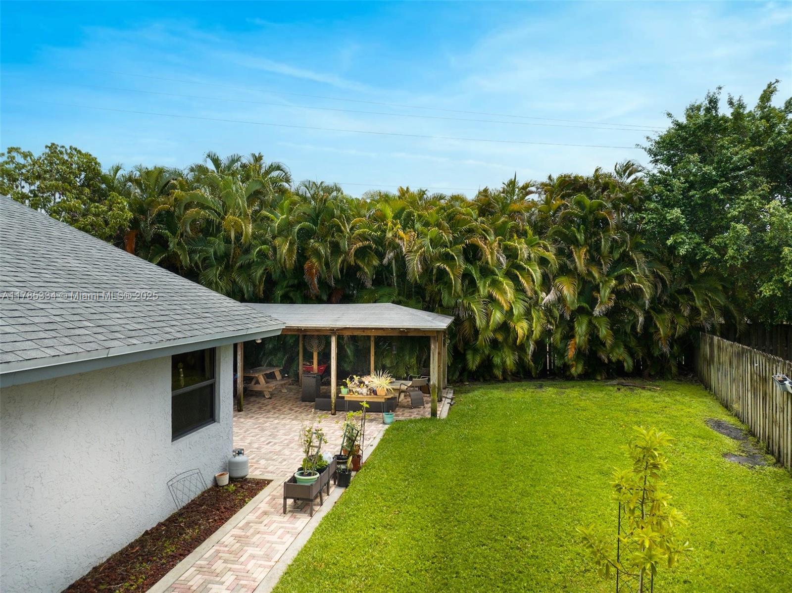 563 Lakeside Circle Sunrise, FL 33326 - Photo 28 of 36 a view of a house with a yard
