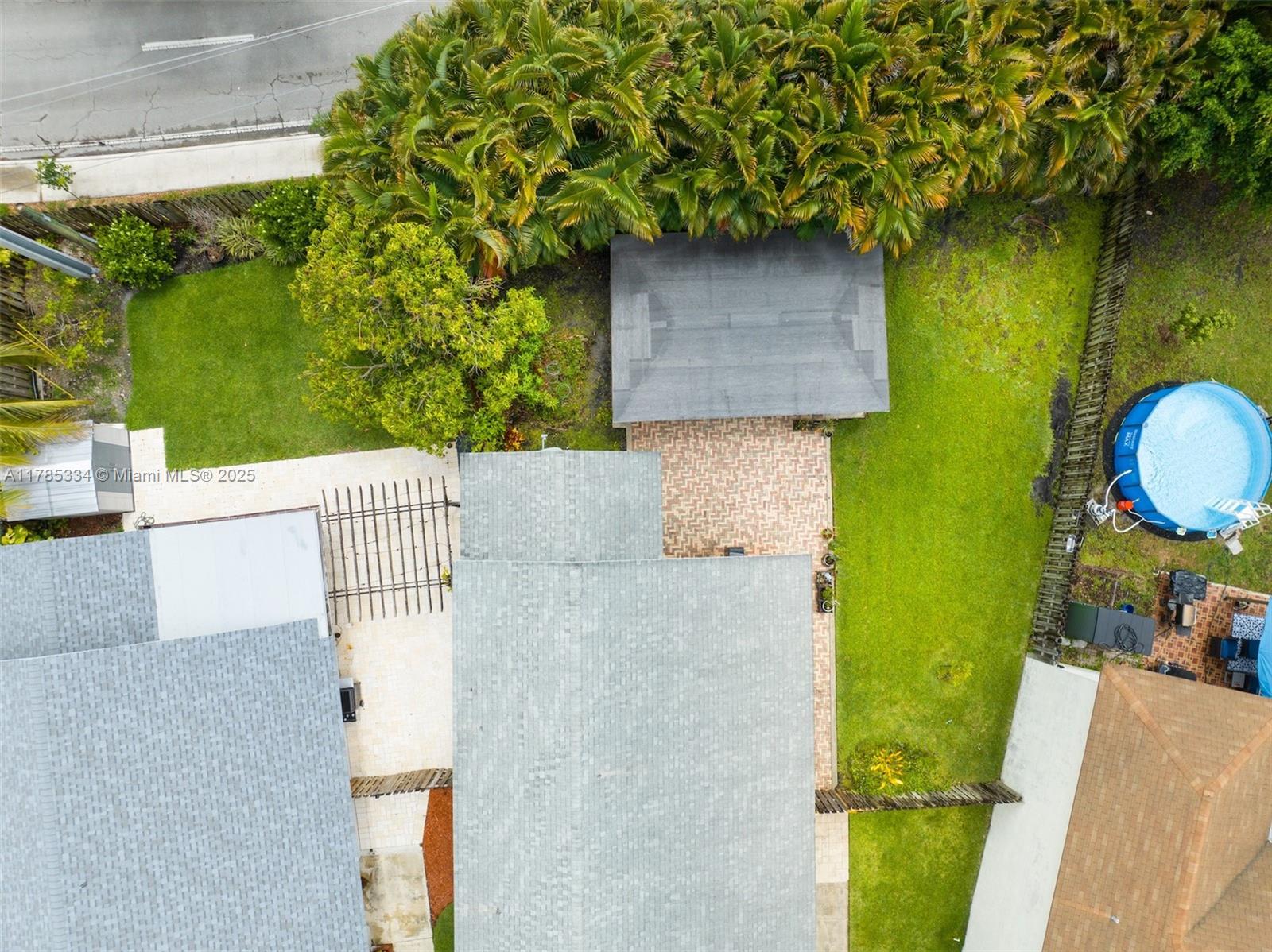 563 Lakeside Circle Sunrise, FL 33326 - Photo 31 of 36 swimming pool view with a garden and plants