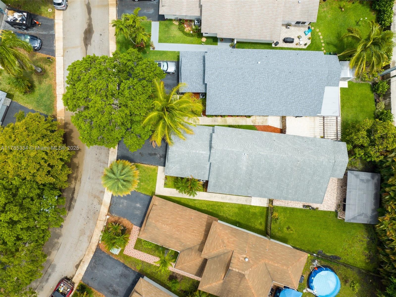 563 Lakeside Circle Sunrise, FL 33326 - Photo 32 of 36 an aerial view of a house with a swimming pool