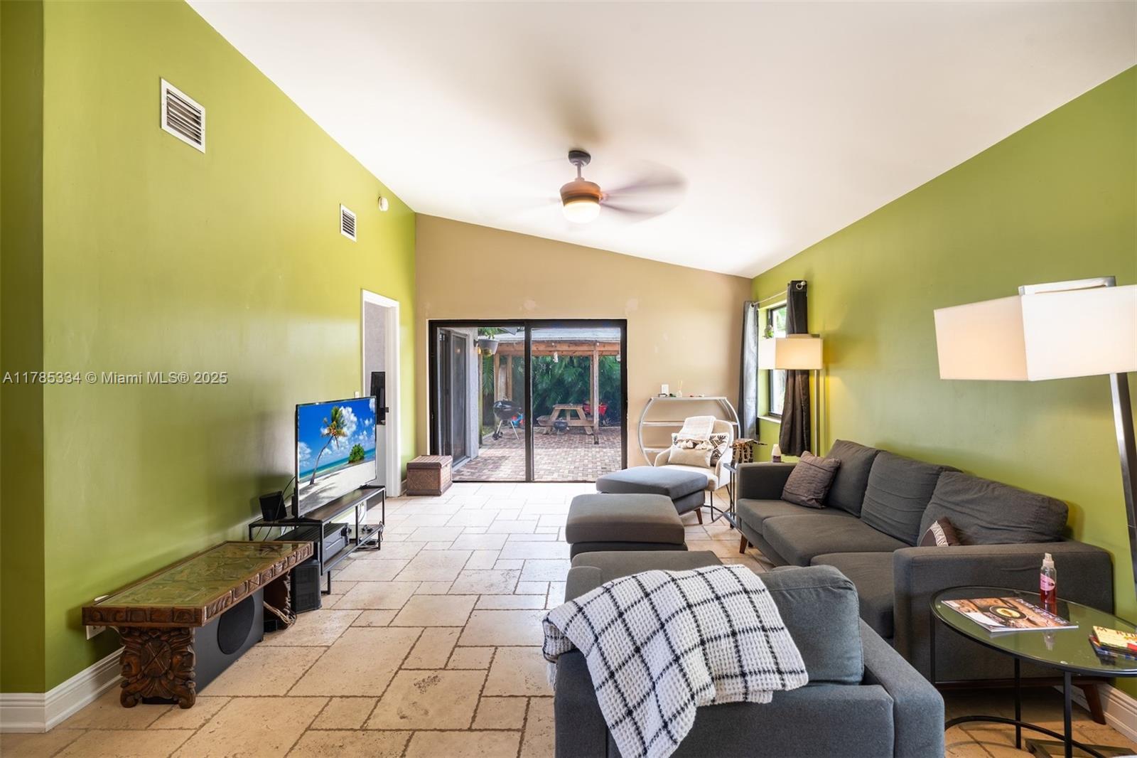 563 Lakeside Circle Sunrise, FL 33326 - Photo 6 of 36 a living room with furniture and a large window