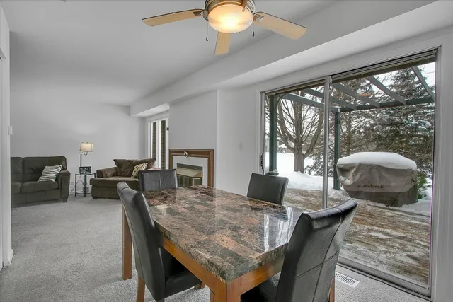 a view of a dining room with furniture window and outside view