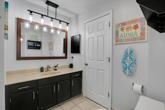a bathroom with a double vanity sink and a mirror