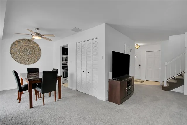 a view of a livingroom with furniture and a flat screen tv