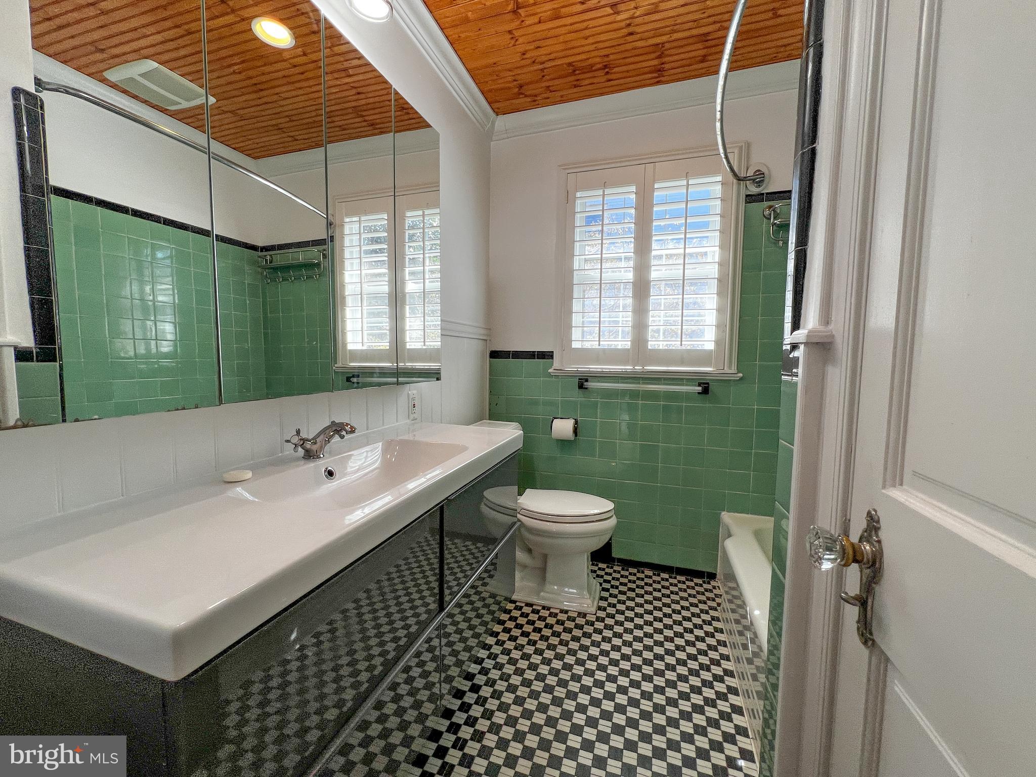314 Hillmoor Drive Silver Spring, MD 20901 - Photo 13 of 24 a bathroom with a sink toilet and window