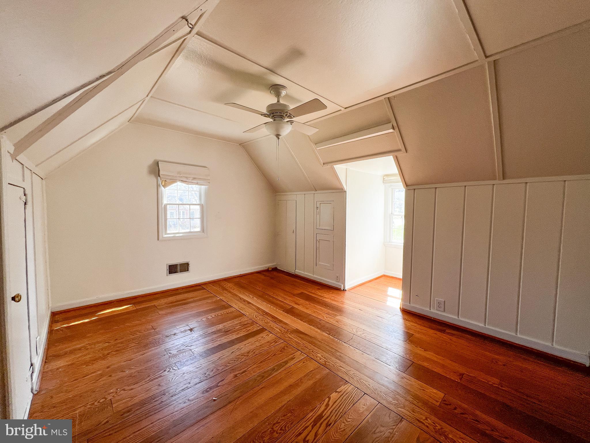 314 Hillmoor Drive Silver Spring, MD 20901 - Photo 16 of 24 a view of an empty room with wooden floor and a window