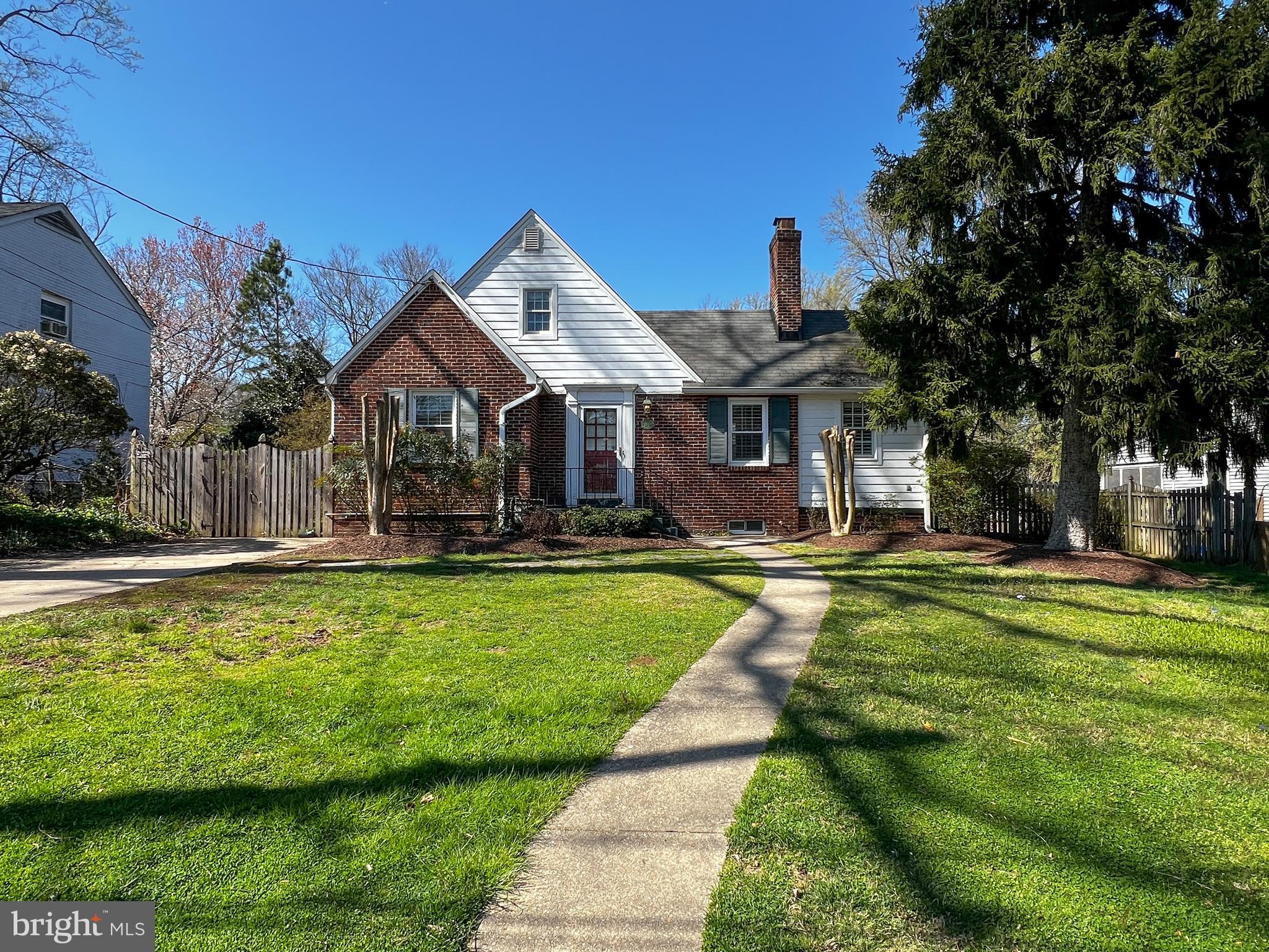 314 Hillmoor Drive Silver Spring, MD 20901 - Photo 2 of 24 a front view of a house with swimming pool having outdoor seating