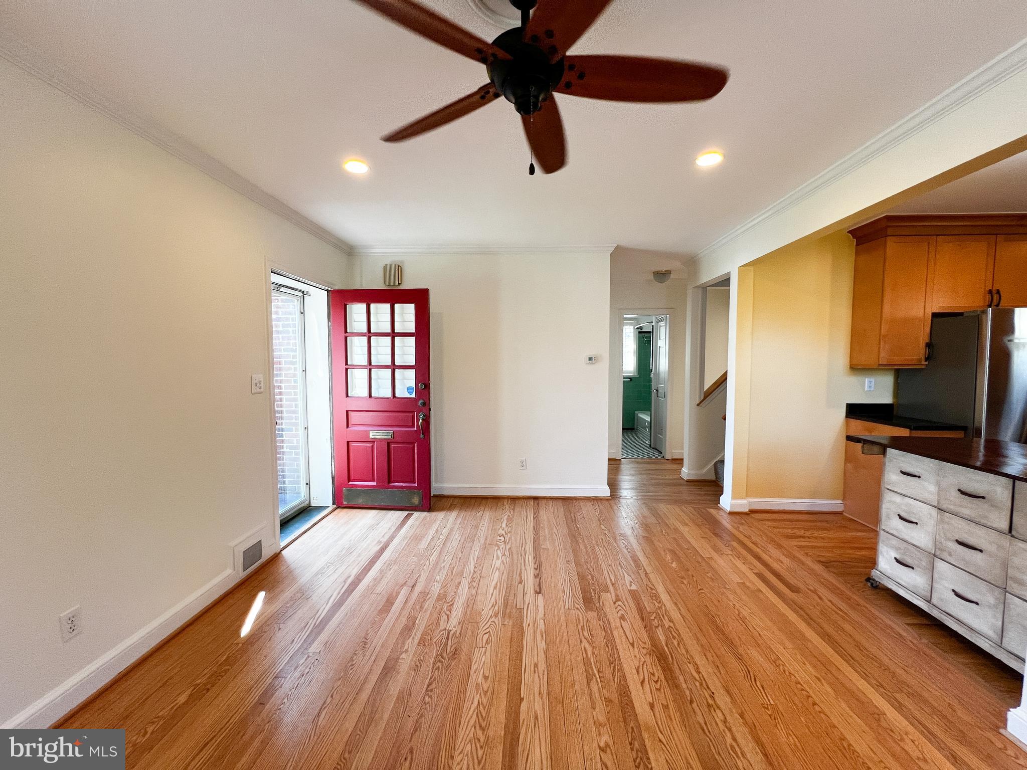 314 Hillmoor Drive Silver Spring, MD 20901 - Photo 5 of 24 a view of an empty room with window and wooden floor
