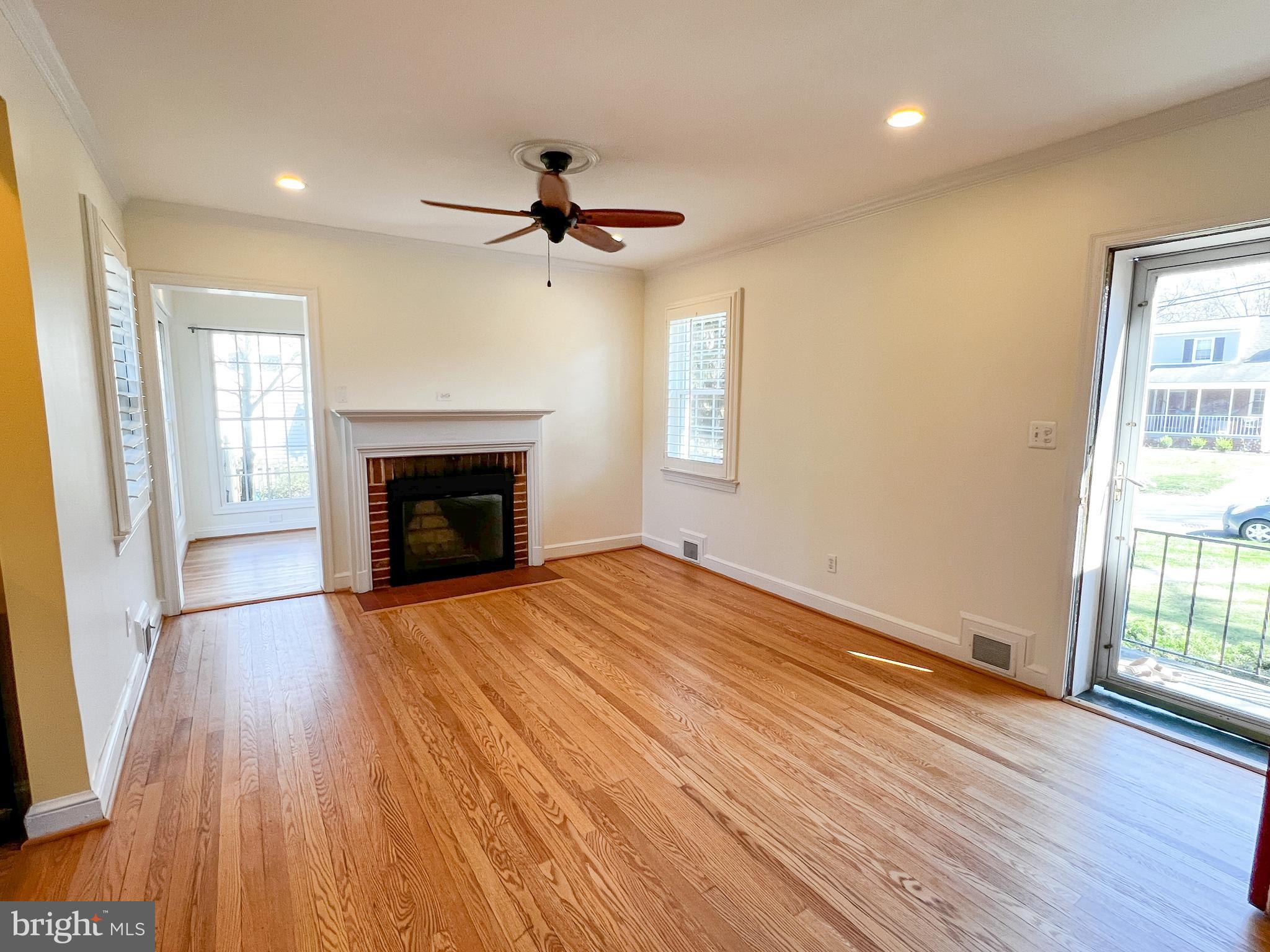314 Hillmoor Drive Silver Spring, MD 20901 - Photo 6 of 24 a view of empty room with wooden floor and fireplace