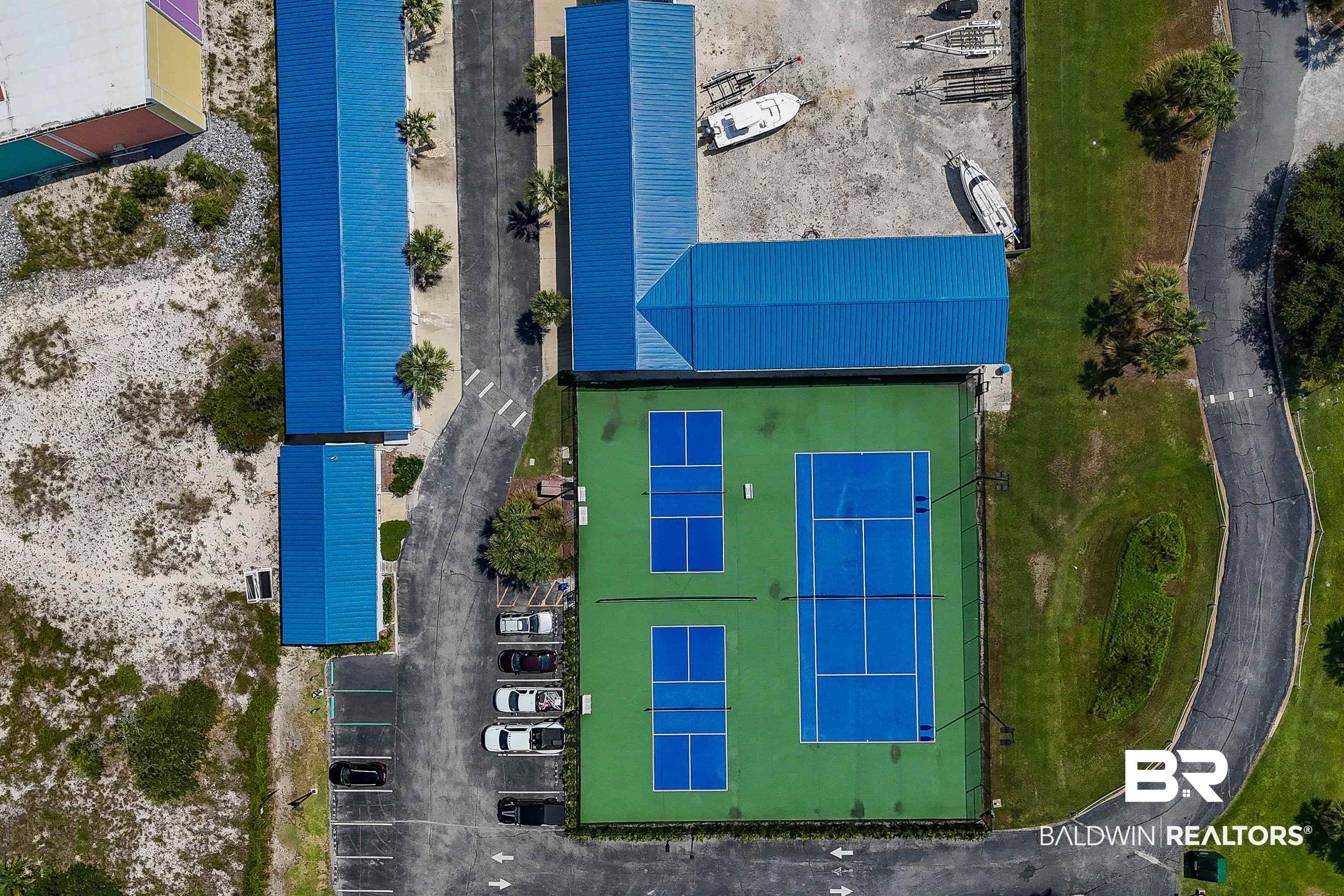 16287 Perdido Key Drive, Unit 105 Pensacola, FL 32507 - Photo 62 of 66 Outdoor recreation area featuring two tennis courts, two pickleball courts, and paved parking