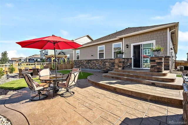 a view of a house with sitting area and furniture