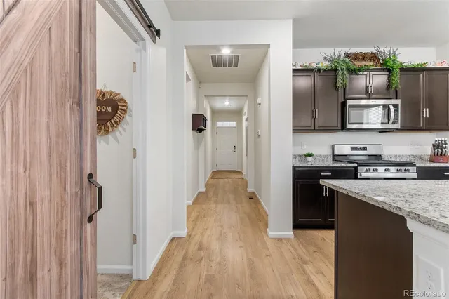 a view of a kitchen from the hallway
