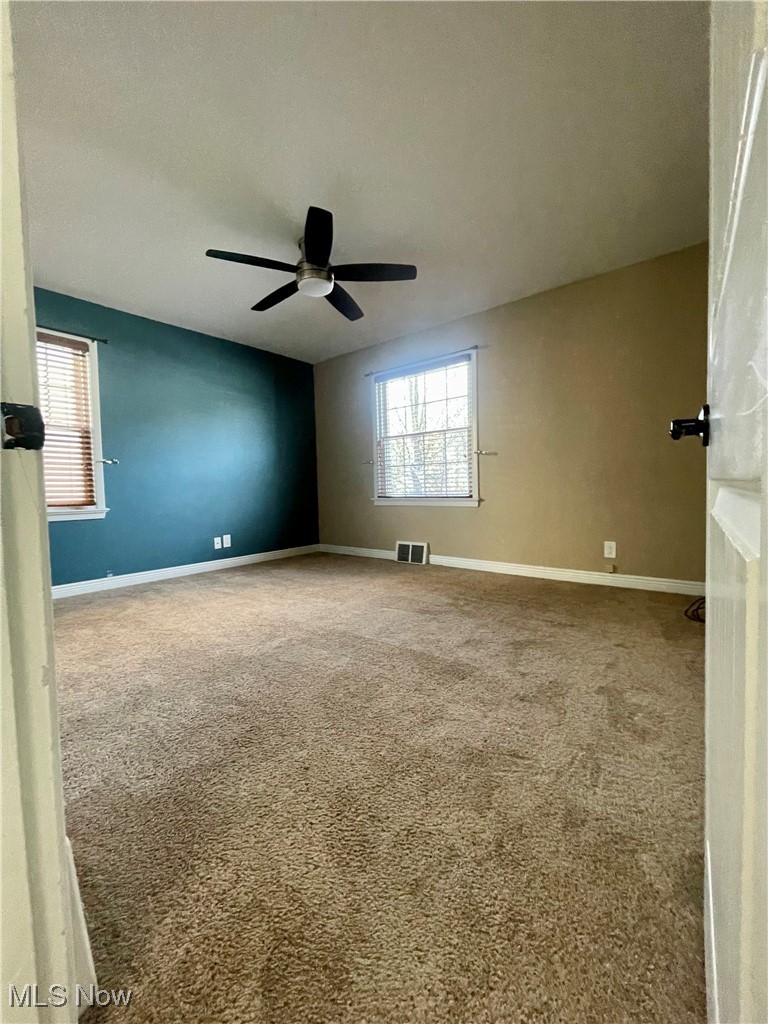1544 Edgefield Road Lyndhurst, OH 44124 - Photo 18 of 36 Empty room with light carpet and a textured ceiling