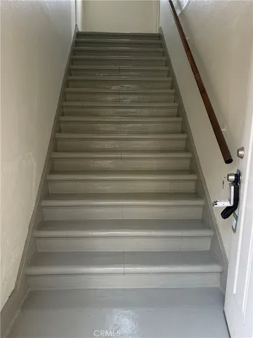 a backyard of a house with outdoor seating