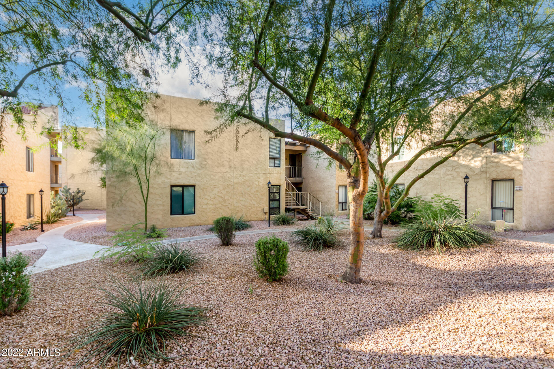 4950 North Miller Road, Unit 100 Scottsdale, AZ 85251 - Photo 1 of 1 a view of a house with a patio