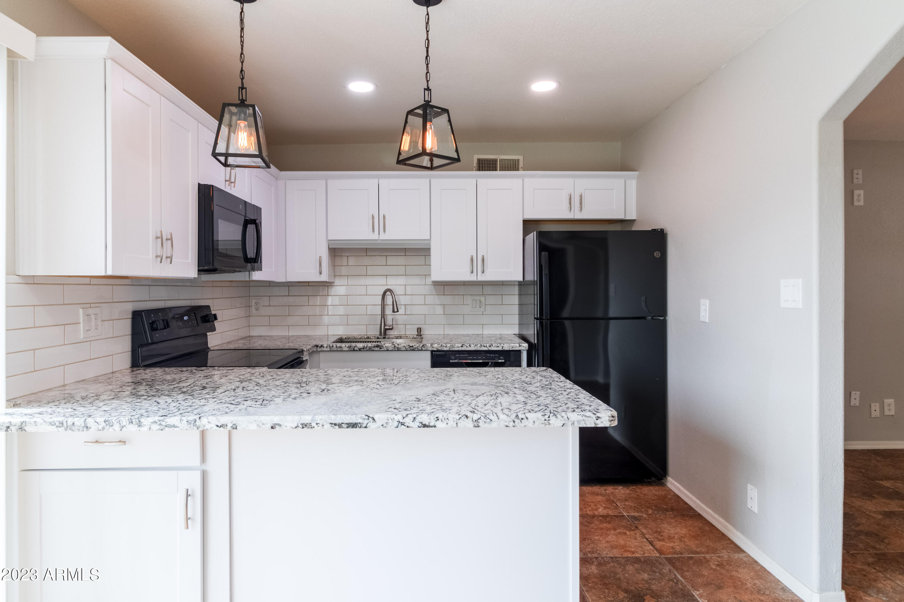 4523 West Granada Road Phoenix, AZ 85035 - Photo 10 of 24 Kitchen w/ Breakfast Bar