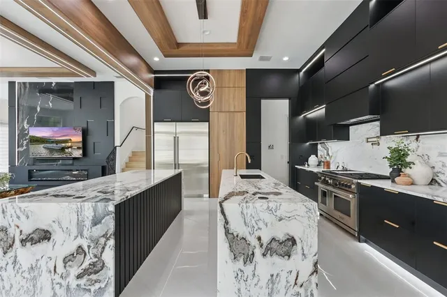 a kitchen with a table and chairs in it