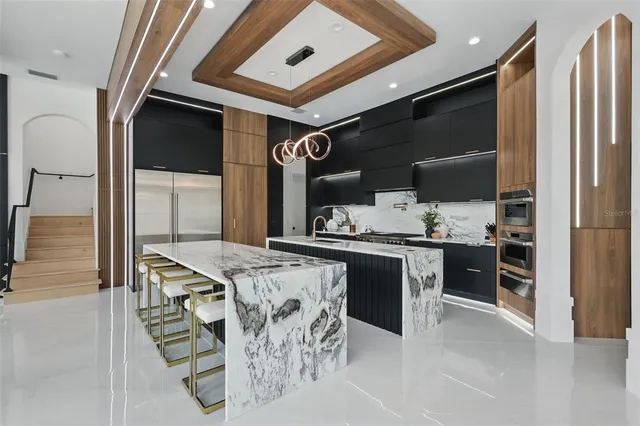 a kitchen with a stove and a refrigerator