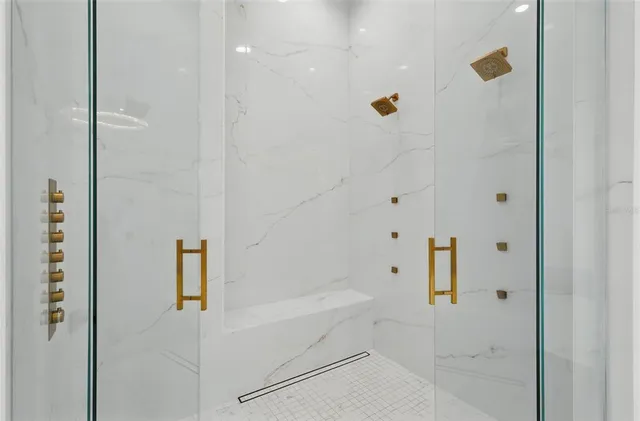 a kitchen with stainless steel appliances kitchen island granite countertop a cabinets and a couch